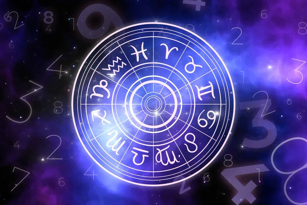 Zodiac wheel with glowing sign symbols against a purple starry sky with floating numbers for Prashna Jyotish question astrology