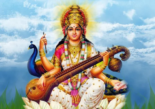 Goddess Saraswati seated on a lotus playing the veena beside a peacock, representing Saraswati Havan
